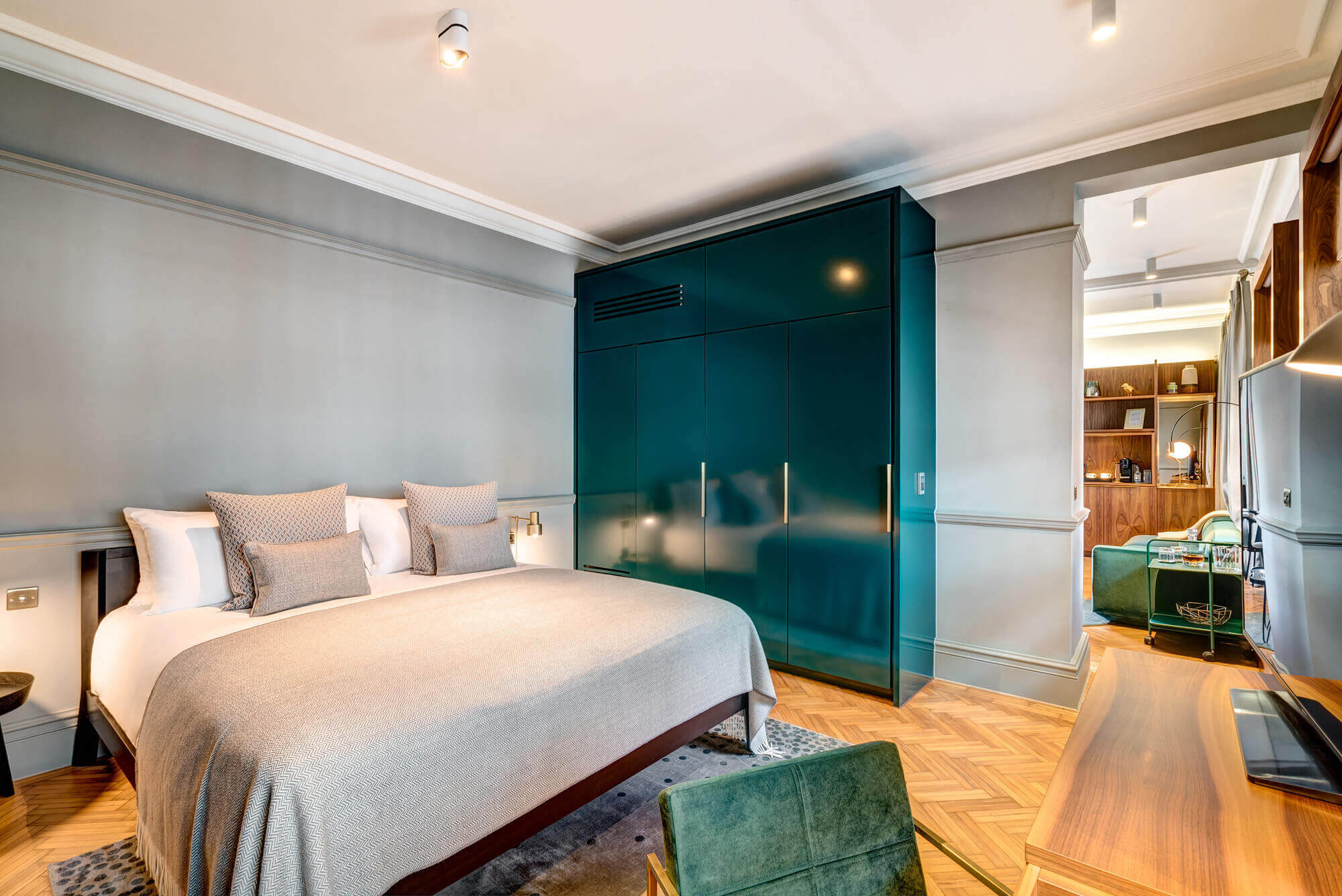 Grand Suite bedroom featuring a Queen size bed looking into separate living area at Apex Temple Court Hotel Grand Suite bedroom featuring a Queen size bed looking into separate living area at Apex Temple Court Hotel