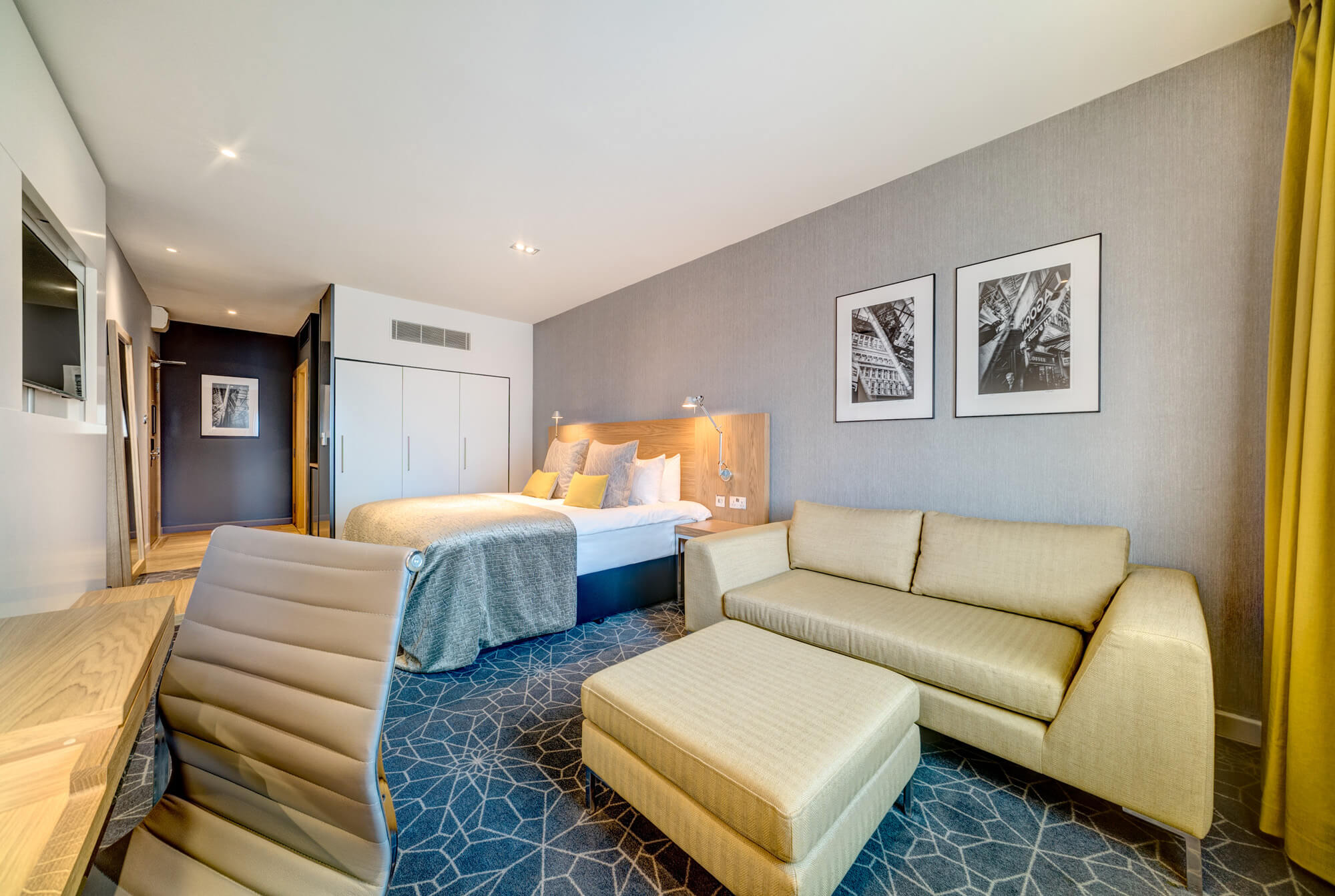 Superior Room at Apex City of Glasgow Hotel Superior Room with sofa, desk and TV