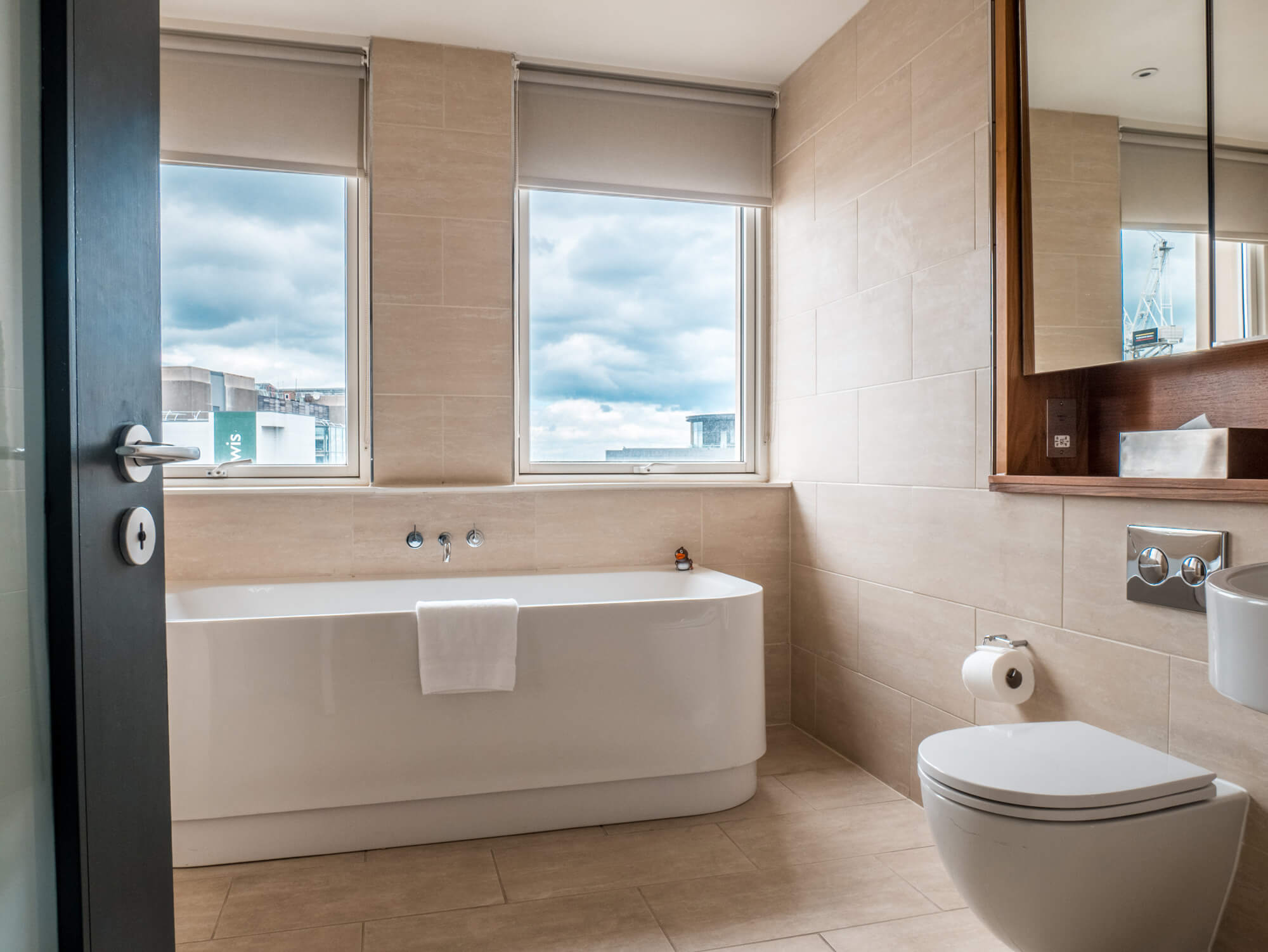 Deluxe Room bathroom with freestanding bath at Apex Waterloo Place Hotel