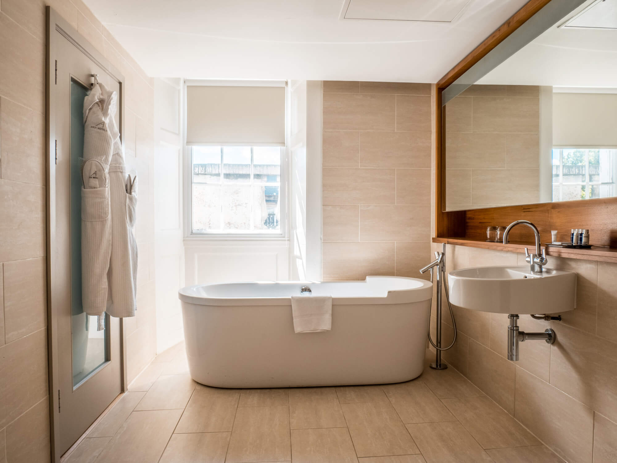 Master Suite bathroom with free standing bathtub at Apex Waterloo Place Hotel