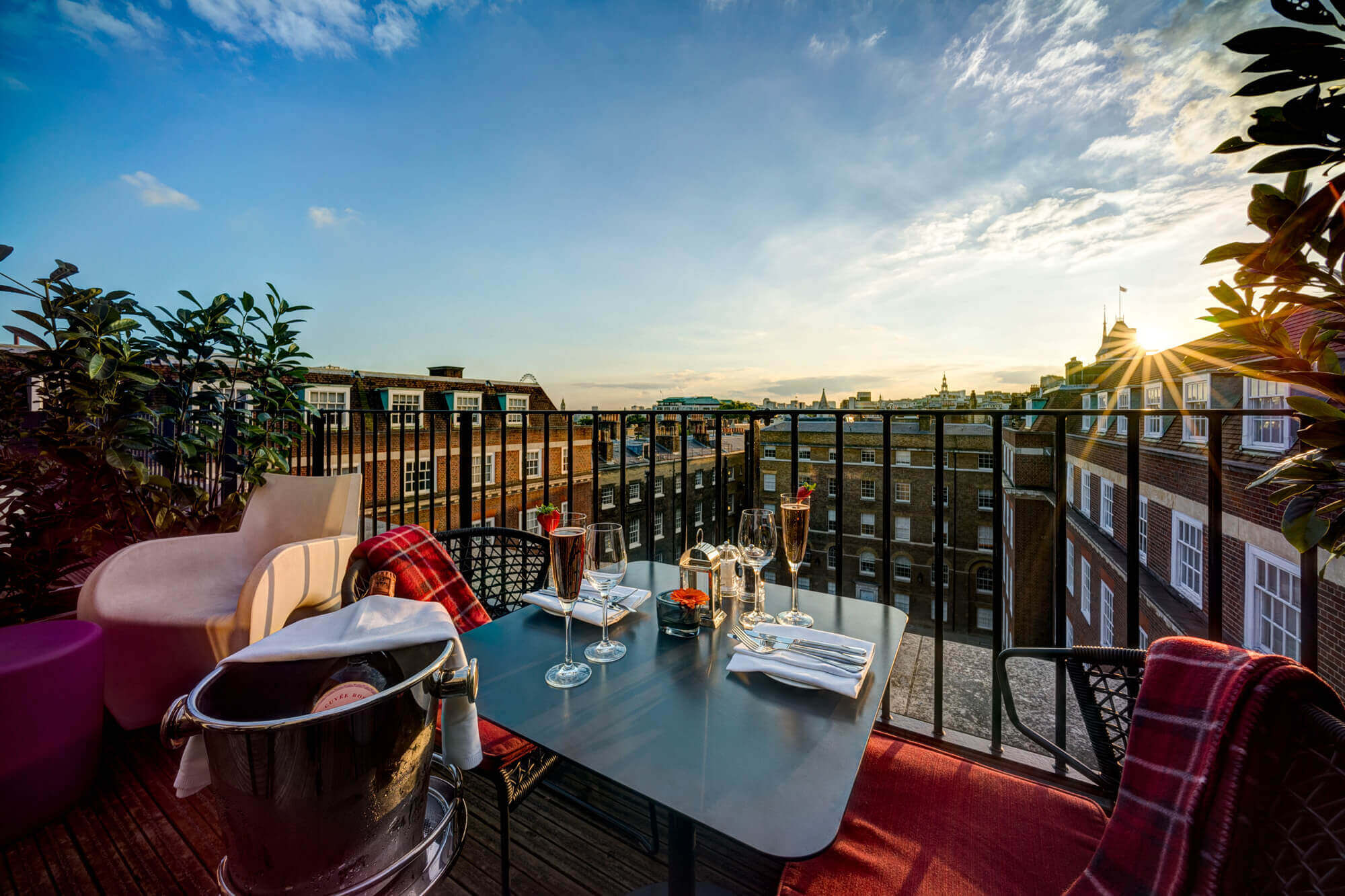 Champagne dinner set up on the balcony of a Apex Temple Court Hotel Deluxe Room