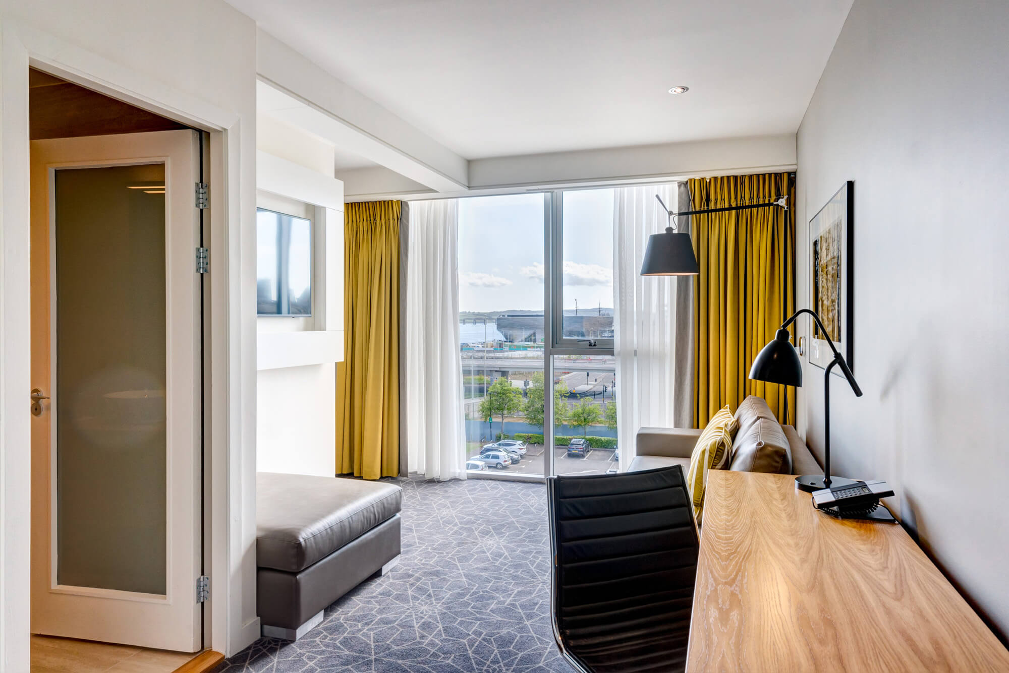 Living area in Junior Suite at Apex City Quay Hotel