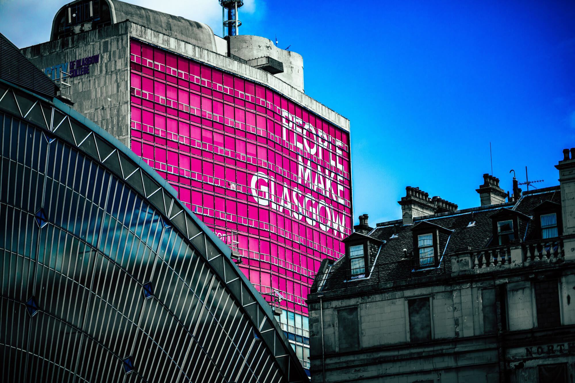 People make Glasgow sign on side of building