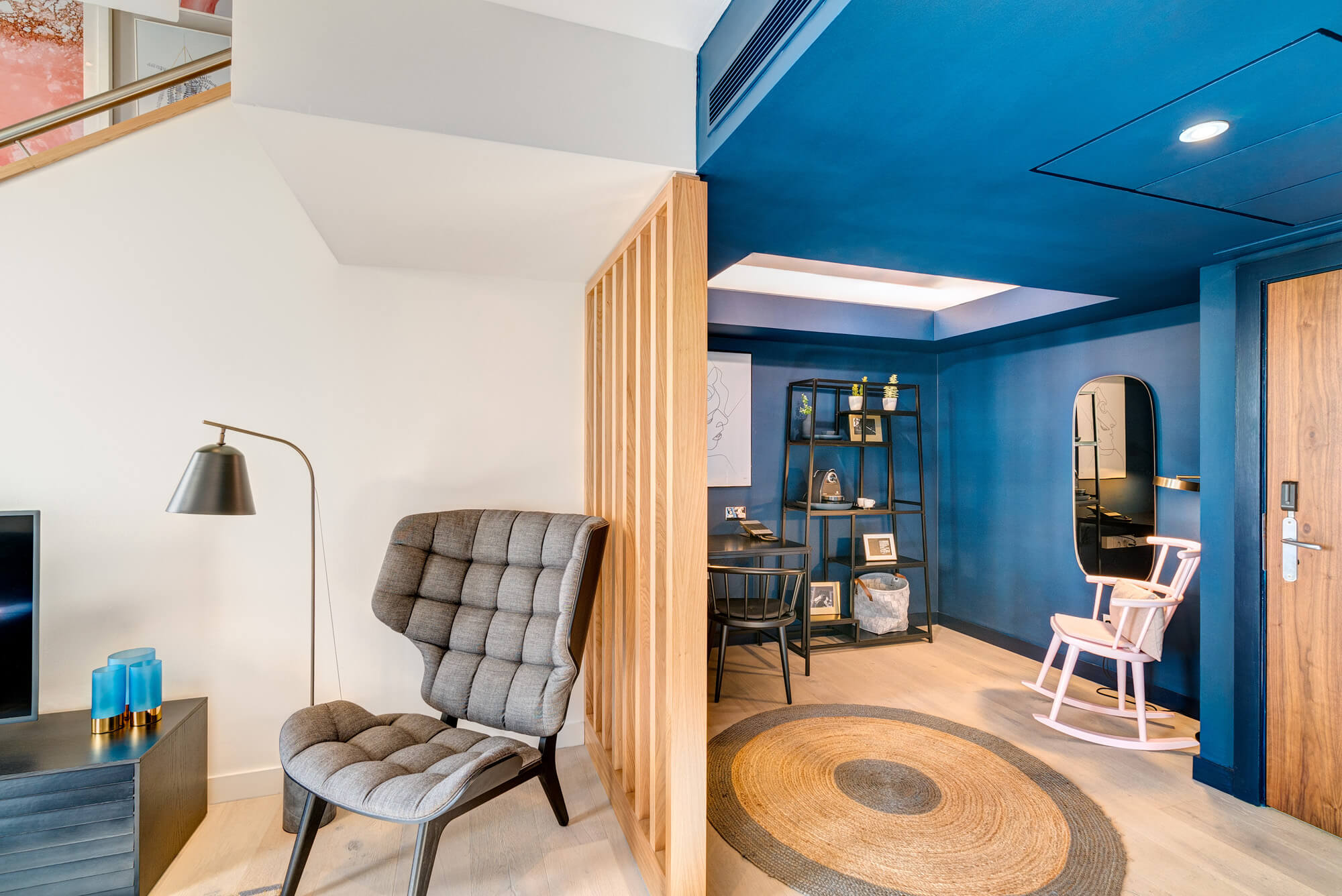 Duplex Suite living area with chair and desk at Apex Waterloo Place Hotel