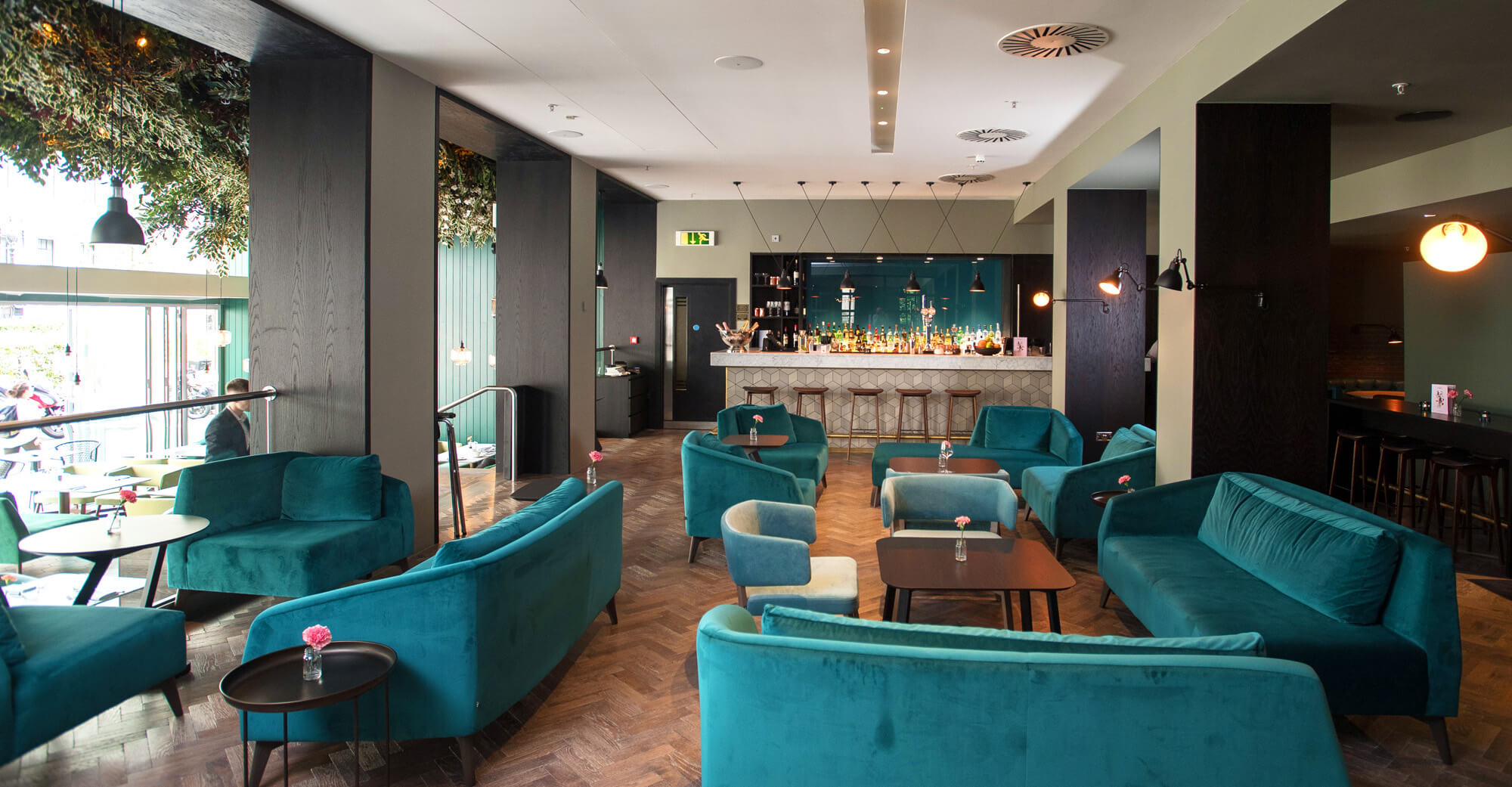 The Lampery, Seething Lane restaurant with plush velvet sofas and chairs in bar area